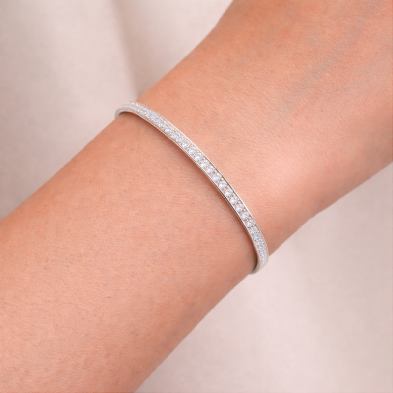 Channel set crystal cuff bracelet worn on the wrist, showing slim profile and elegant fit.