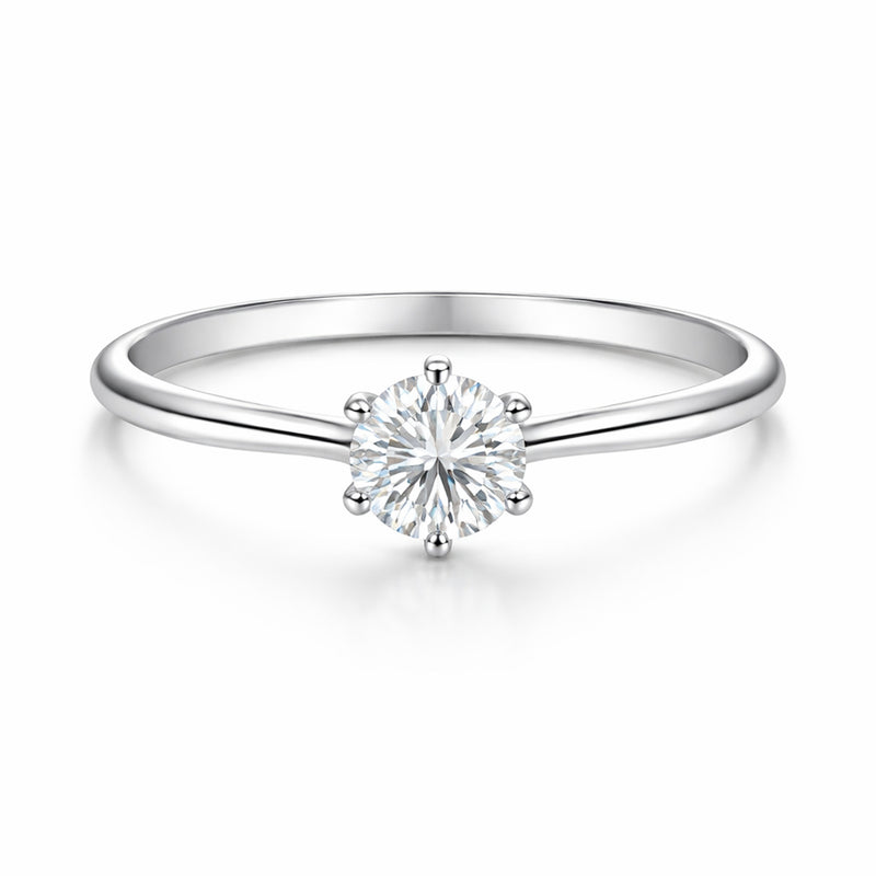 Studio view of the classic solitaire cubic zirconia ring in silver tone finish, centered on a clean background and featuring a round cut center stone in a prong setting.
