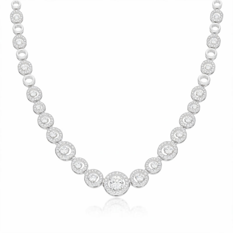 Front facing studio image of a halo style silver tone necklace featuring round cubic zirconia stones.