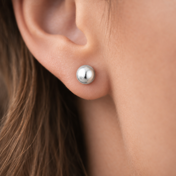 Julie Polished Ball Stud Earrings in Silver Tone, worn on ear.