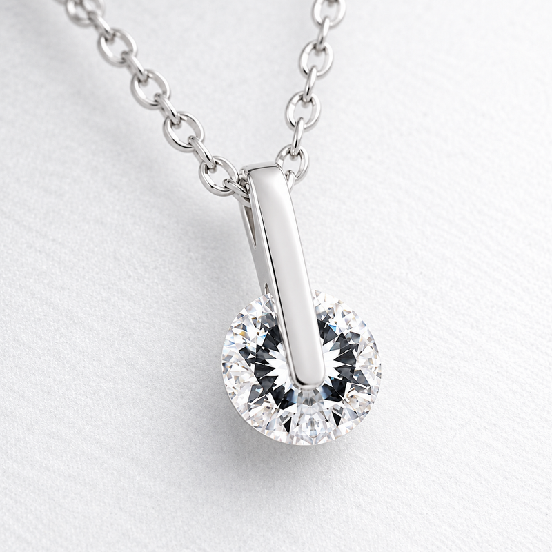 Polished Bar and Round Clear Stone Pendant in Silver Tone, close up.