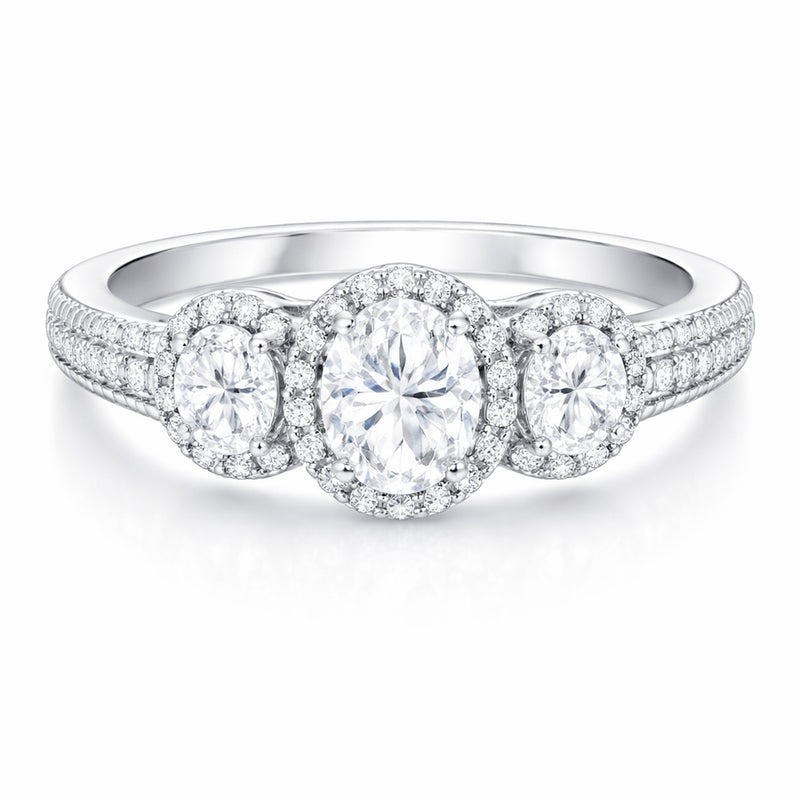 Front facing studio view of a three stone halo cubic zirconia ring in silver tone finish with symmetrical stone arrangement.