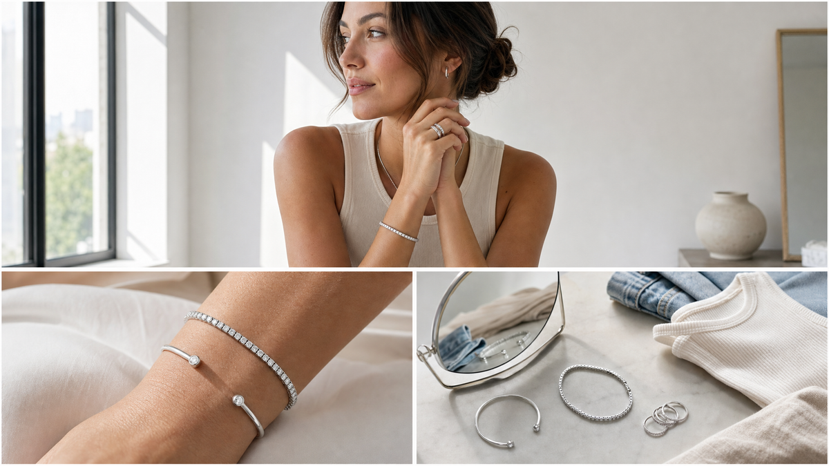 Editorial photo of a woman wearing a silver tone tennis bracelet and ring stack in soft natural light