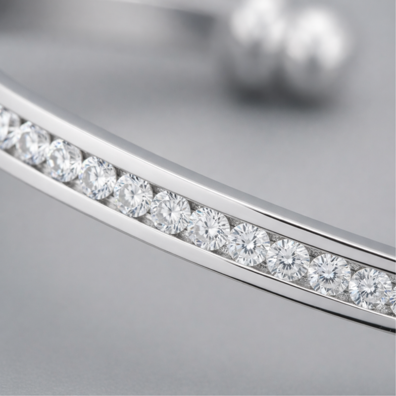 Close up view of the channel set cubic zirconia stones set in polished rhodium plated brass.