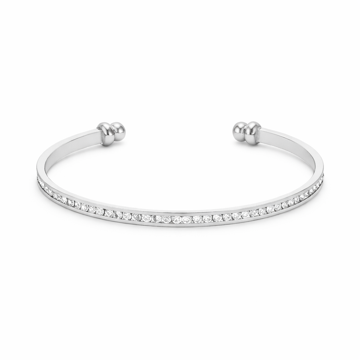 Studio image of a channel set crystal cuff bracelet in silver tone with clean, modern design.