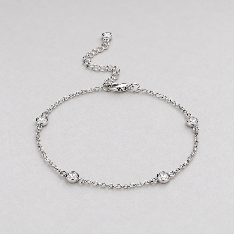 Clara Clear Station Bracelet in Silver Tone, studio view.