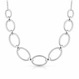 Front facing studio image of an oval link chain necklace featuring polished silver tone links.