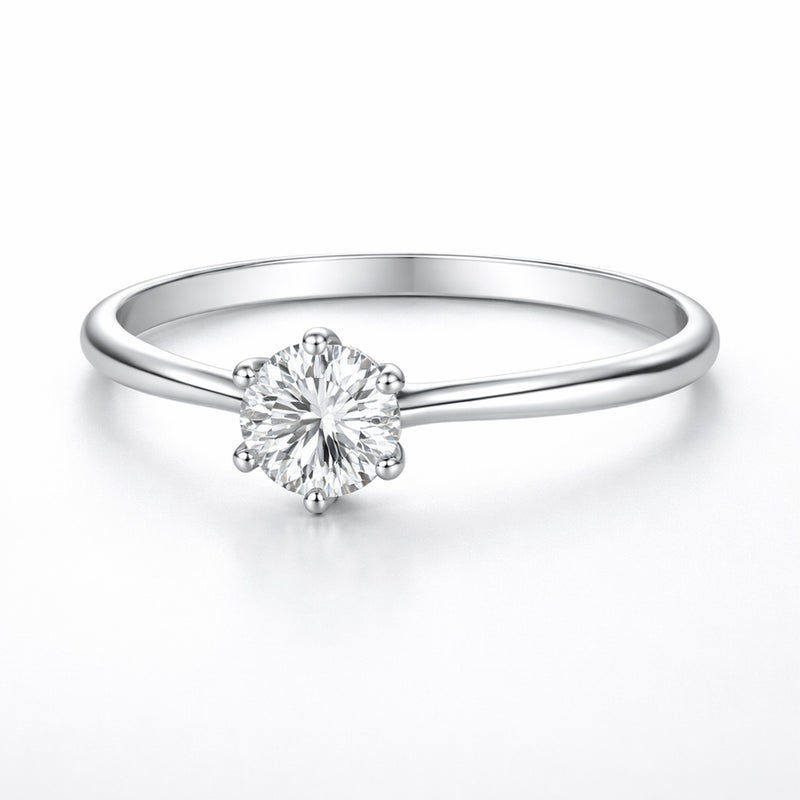 Front facing view of the classic solitaire cubic zirconia ring highlighting the round cut stone and the slim polished band design.