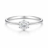 Studio view of the classic solitaire cubic zirconia ring in silver tone finish, centered on a clean background and featuring a round cut center stone in a prong setting.