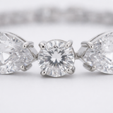 Close up detail of cubic zirconia stones and precise setting in rhodium plated brass.