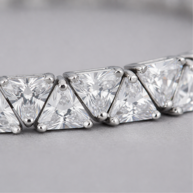 Close up detail of cubic zirconia stones and precise setting in rhodium plated brass.