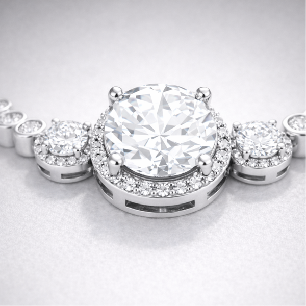 Close up view of the halo style centerpiece with round cut cubic zirconia stones in silver tone setting.