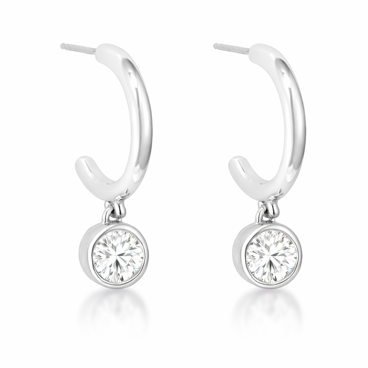 Close-up view of hoop earrings with a polished silver tone finish, each featuring a round cubic zirconia drop in a bezel-style setting.