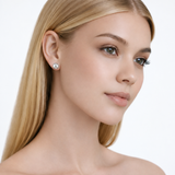 Model wearing julie polished ball stud earrings in silver tone with a neutral off-shoulder top.