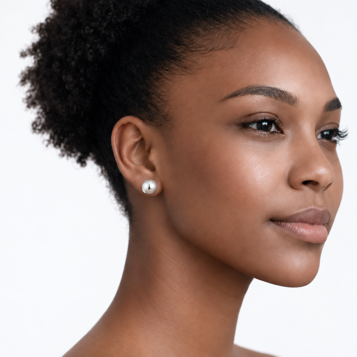 Model wearing julie polished ball stud earrings in silver tone with a neutral off-shoulder top.