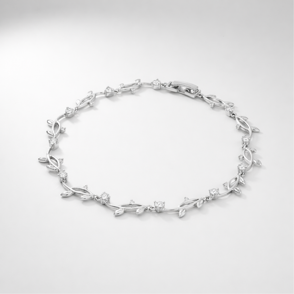 Studio view of a delicate leaf motif bracelet with cubic zirconia stones arranged in an elegant pattern.