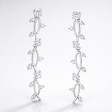 Studio view of the leaf motif drop earrings with elongated design and sparkling cubic zirconia accents.