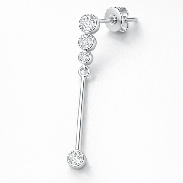 Close up detail of linear drop earring with bezel set cubic zirconia stones and polished silver tone finish.