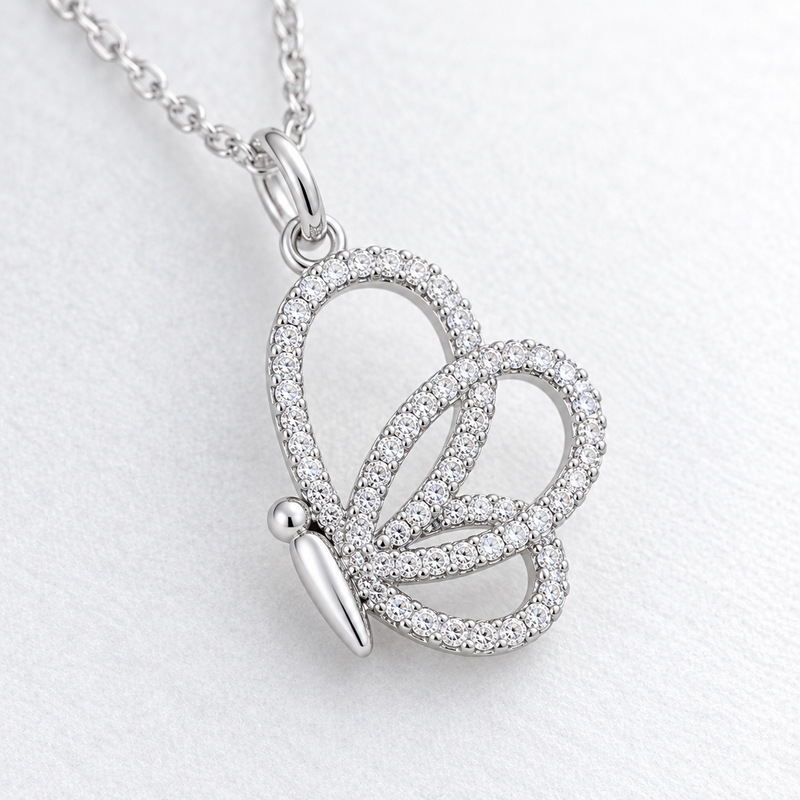 Open Butterfly Clear Stone Pendant in Silver Tone, close up.