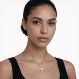 On-model portrait highlights a pear shaped drop cubic zirconia pendant, styled with a black scoop-neck top so the pendant stays centered at the neckline.