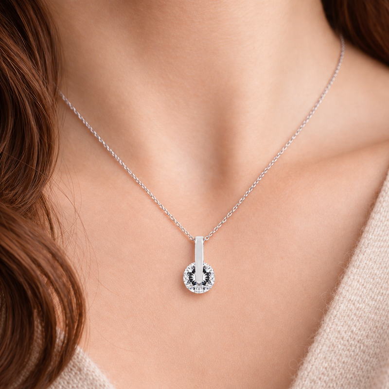Polished Bar and Round Clear Stone Pendant in Silver Tone, worn view.