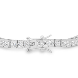 Silver-tone box clasp with two separate safety arms and adjacent clear square stones on white.