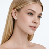 Model wearing rachel round clear stone stud earrings in silver tone with a neutral off-shoulder top.