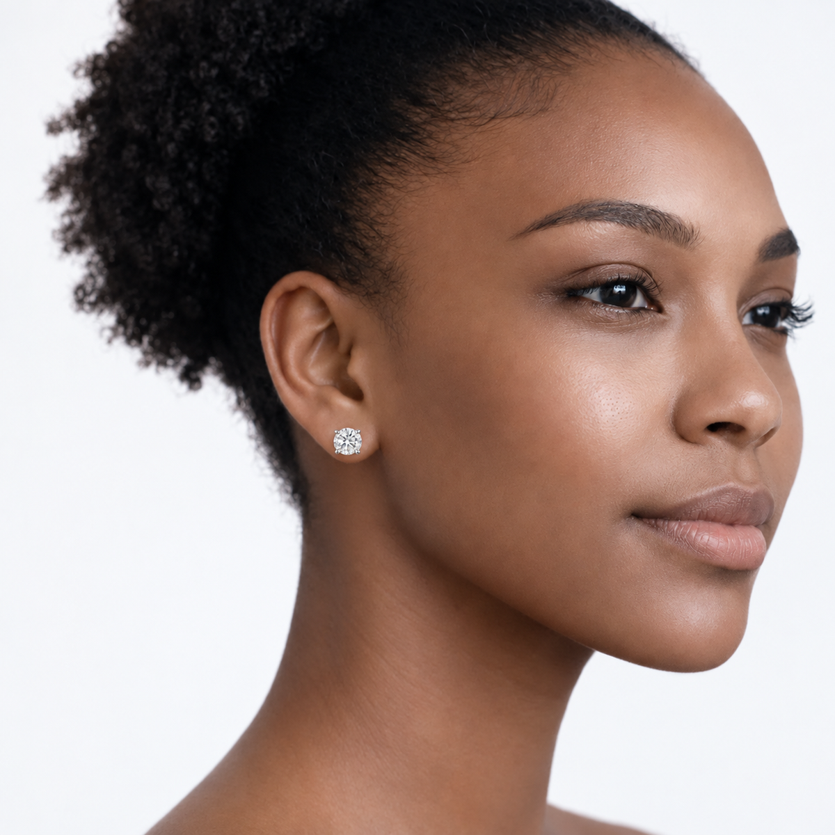 Model wearing rachel round clear stone stud earrings in silver tone with a neutral off-shoulder top.