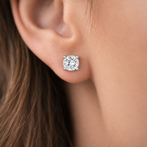 Rachel Round Clear Stone Stud Earrings in Silver Tone, worn on ear.
