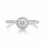 Studio view of the rope style solitaire cubic zirconia ring in silver tone finish, shown centered on a clean background.