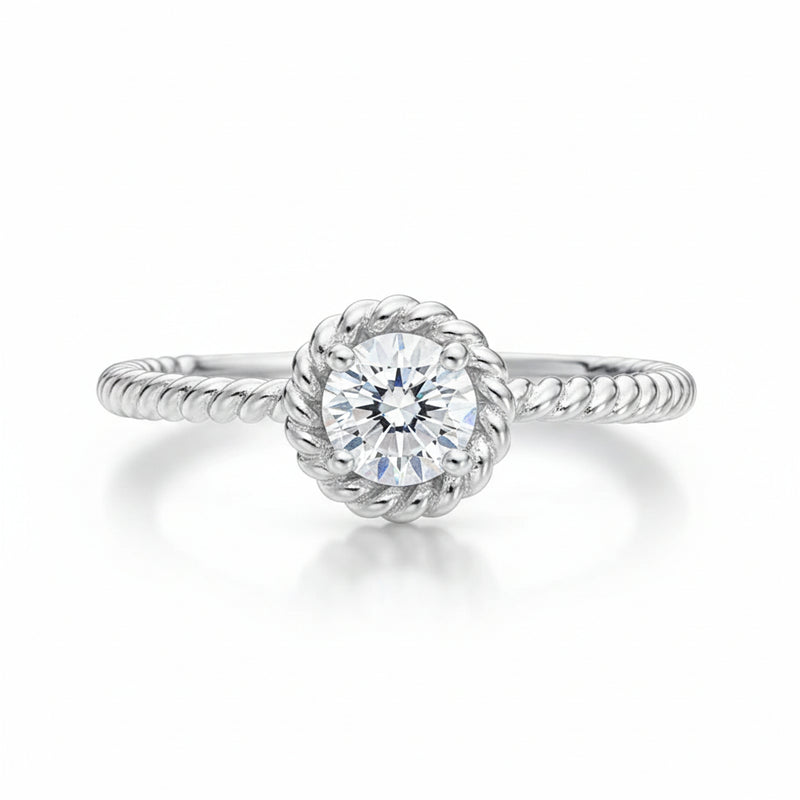 Studio view of the rope style solitaire cubic zirconia ring in silver tone finish, shown centered on a clean background.