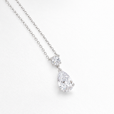 Round and Pear Clear Stone Drop Pendant in Silver Tone, angled view.