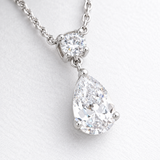 Round and Pear Clear Stone Drop Pendant in Silver Tone, close up.