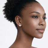 On-model portrait highlights round stud earrings with cubic zirconia, styled with bare shoulders so the earrings frame the face with high-polish shine.