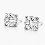 Front facing studio view of round silver tone stud earrings highlighting the symmetry, round cubic zirconia stones, and balanced prong placement.