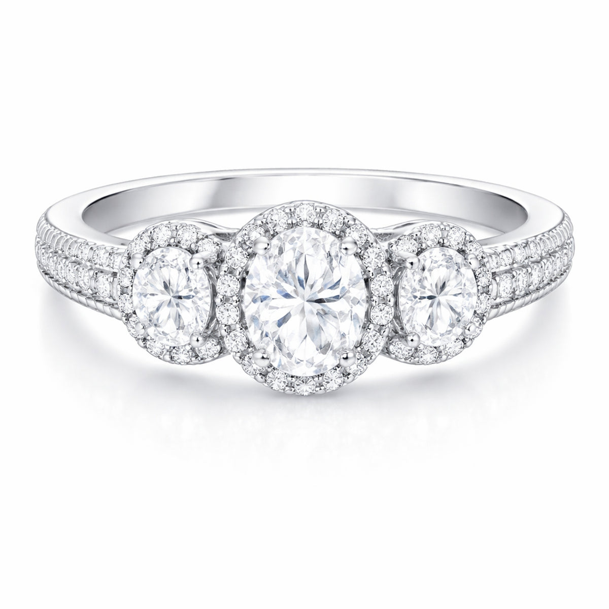 Front facing studio view of a three stone halo cubic zirconia ring in silver tone finish with symmetrical stone arrangement.