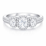 Front facing studio view of a three stone halo cubic zirconia ring in silver tone finish with symmetrical stone arrangement.
